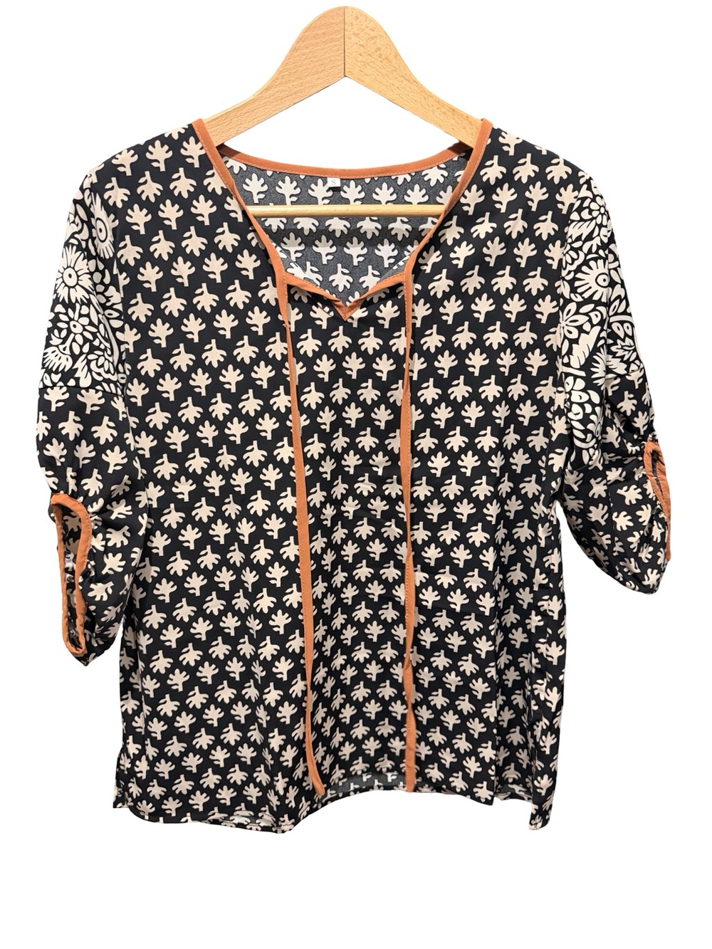 Black and Cream Printed V-Neck Women's Top with Orange Trim